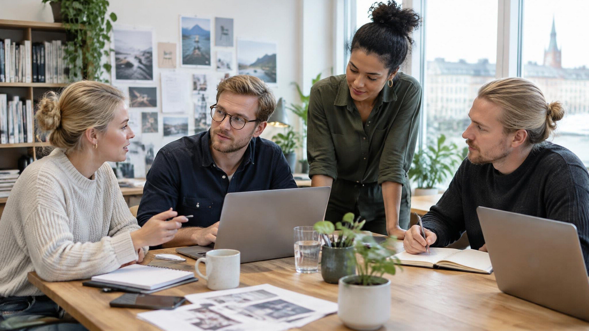Team collaborating around a table in a bright office